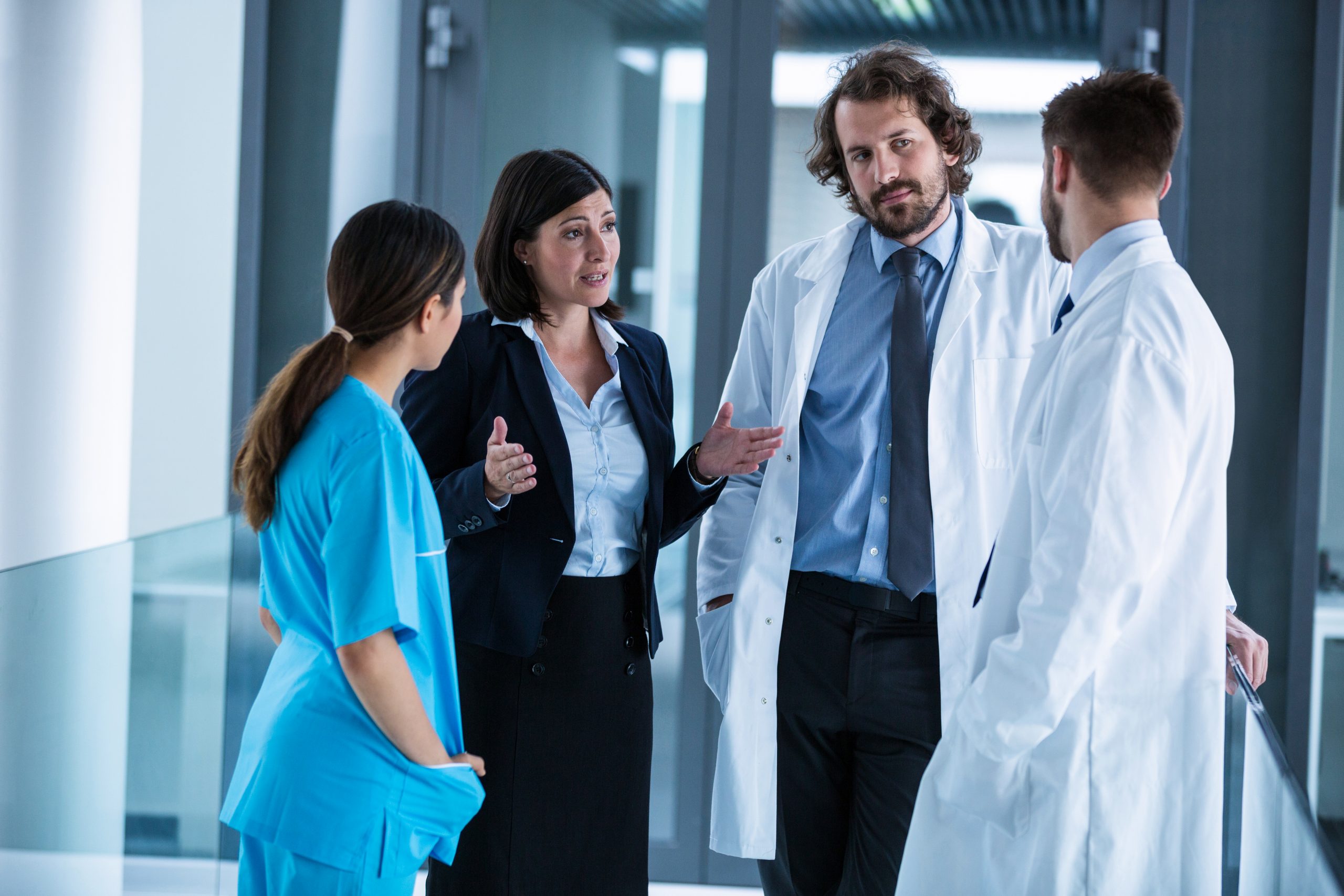 Businesswoman interacting with doctors