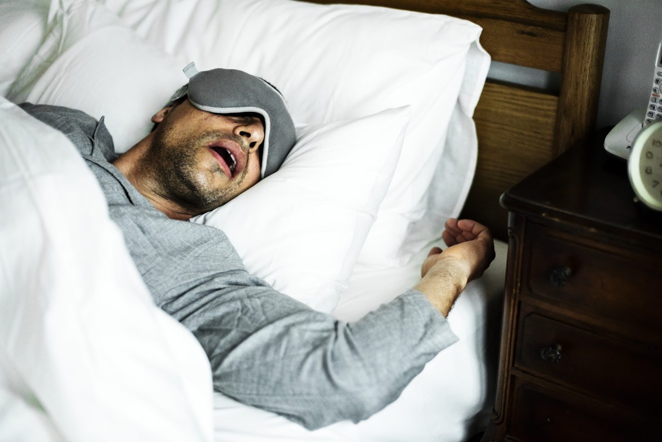 A Man Sleeping On A Bed International Institute Of Sleep