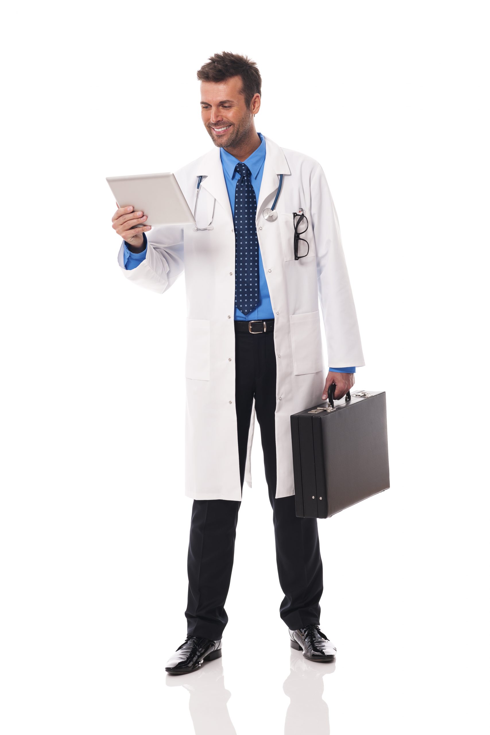 Smiling doctor checking something on digital tablet