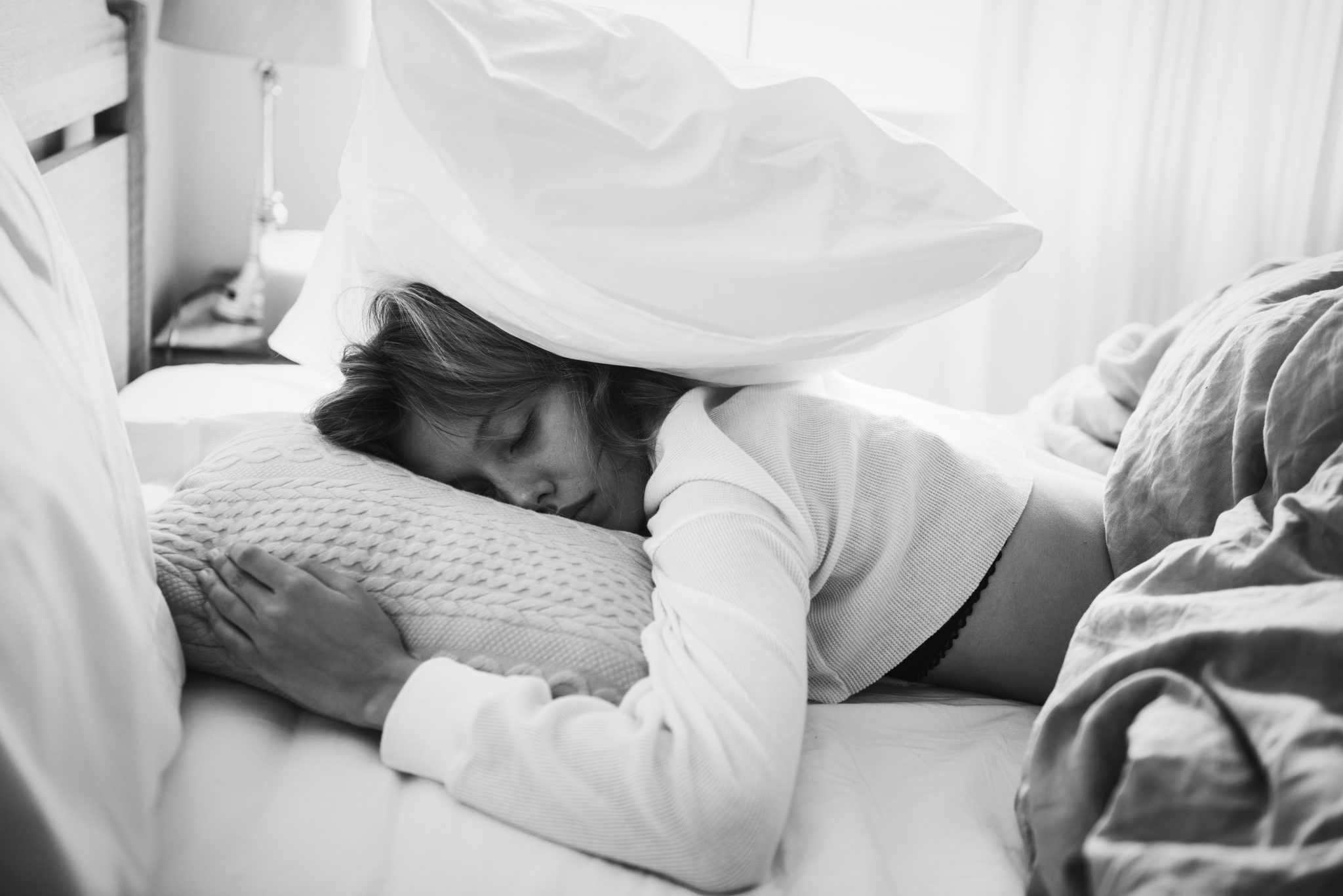 A Caucasian Woman Sleeping On Her Bed PRJYTEH 2048x1367 