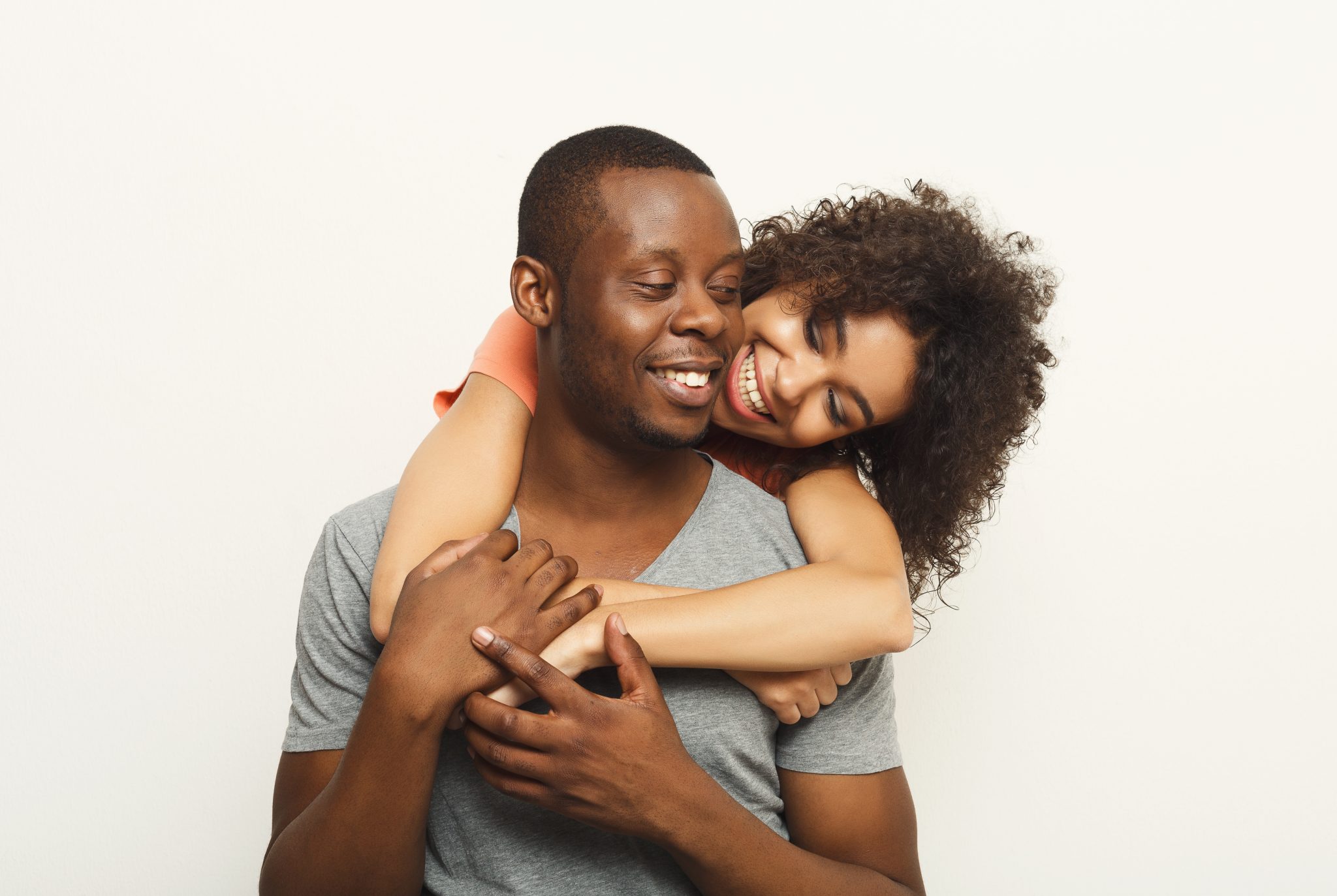 Black Couple Hugging And Posing At White Background International   Black Couple Hugging And Posing At White PRSRRKP 2048x1373 