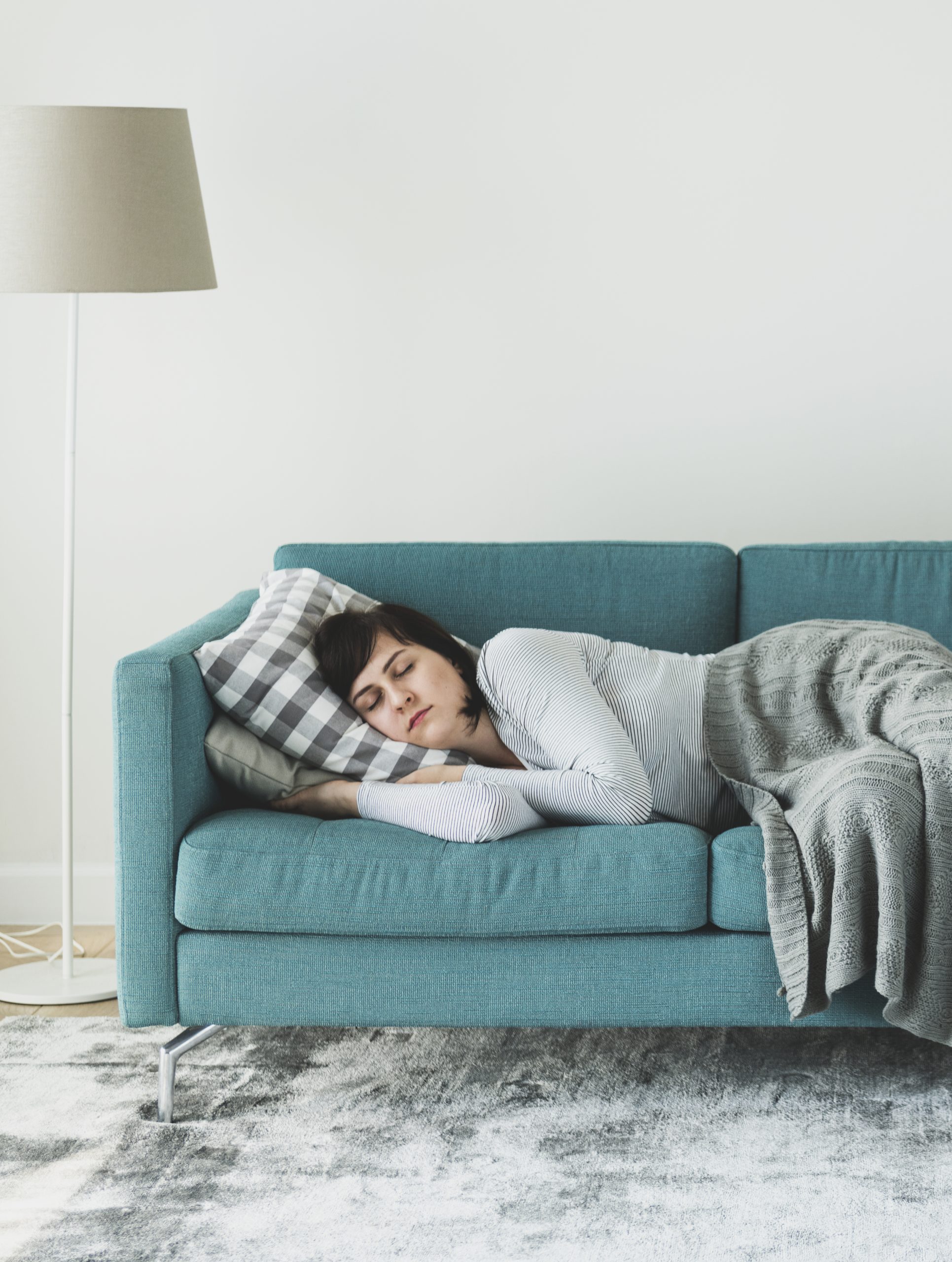 Woman sleeping on the sofa - International Institute of Sleep